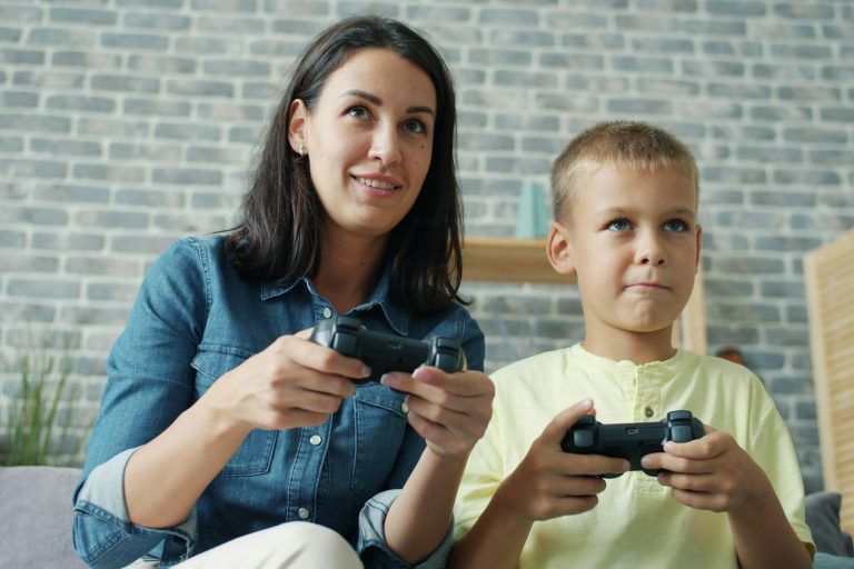 A mother and son playing video games together