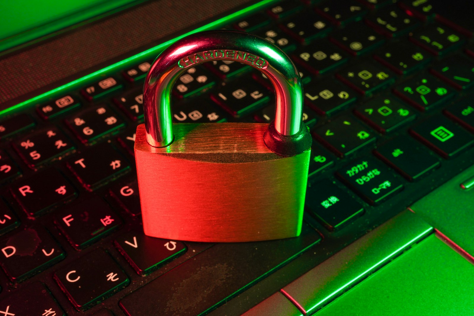 A red padlock on a backlit keyboard